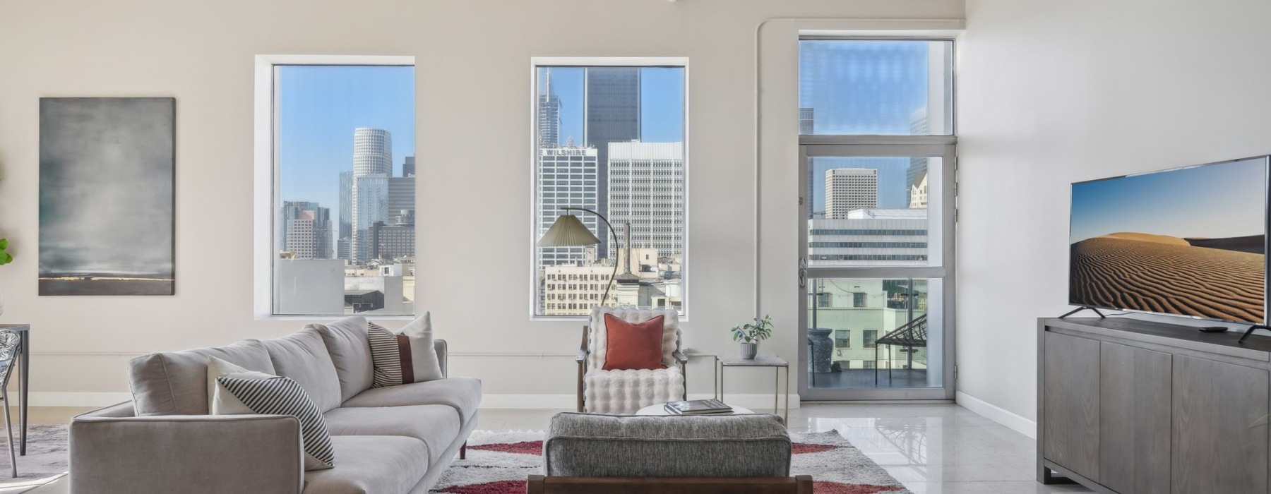 a living room with a tv and couches
